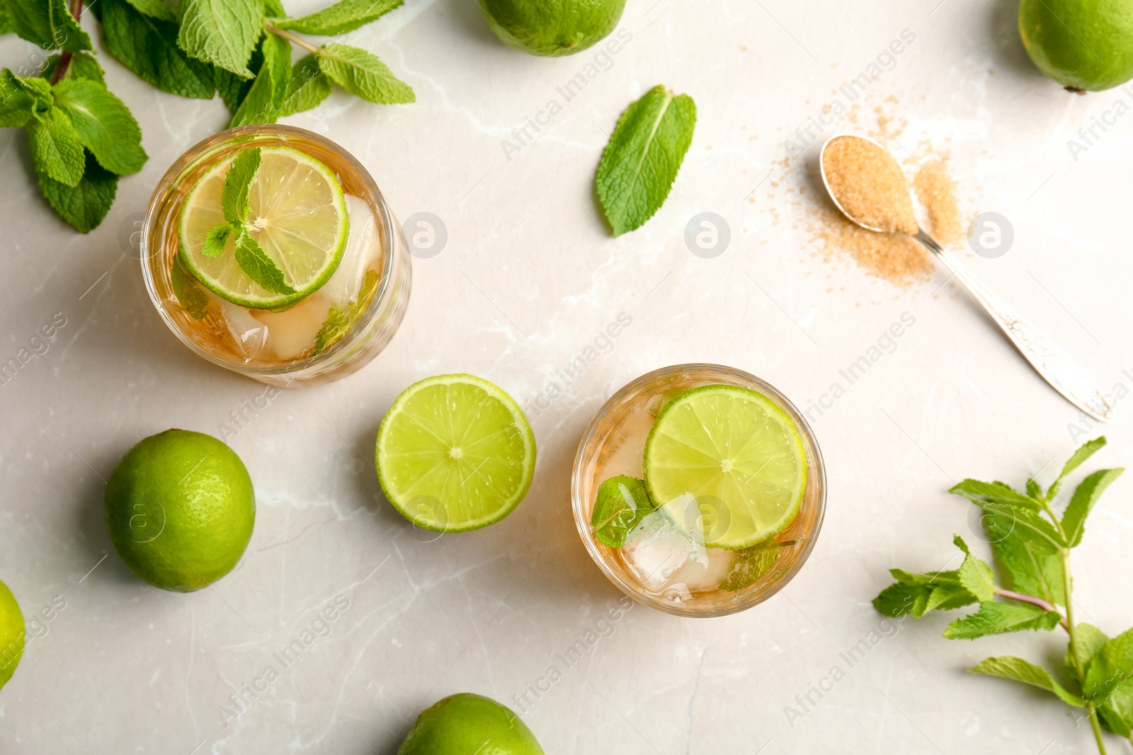 Photo of Flat lay composition with delicious mint julep cocktail on light background