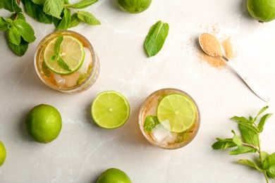 Flat lay composition with delicious mint julep cocktail on light background
