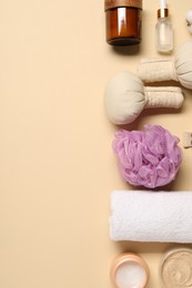 Bath accessories. Flat lay composition with personal care products on beige background, space for text