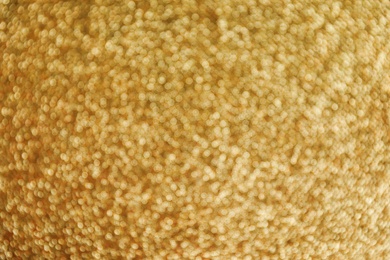 Photo of Gold glitter with bokeh effect as background, closeup