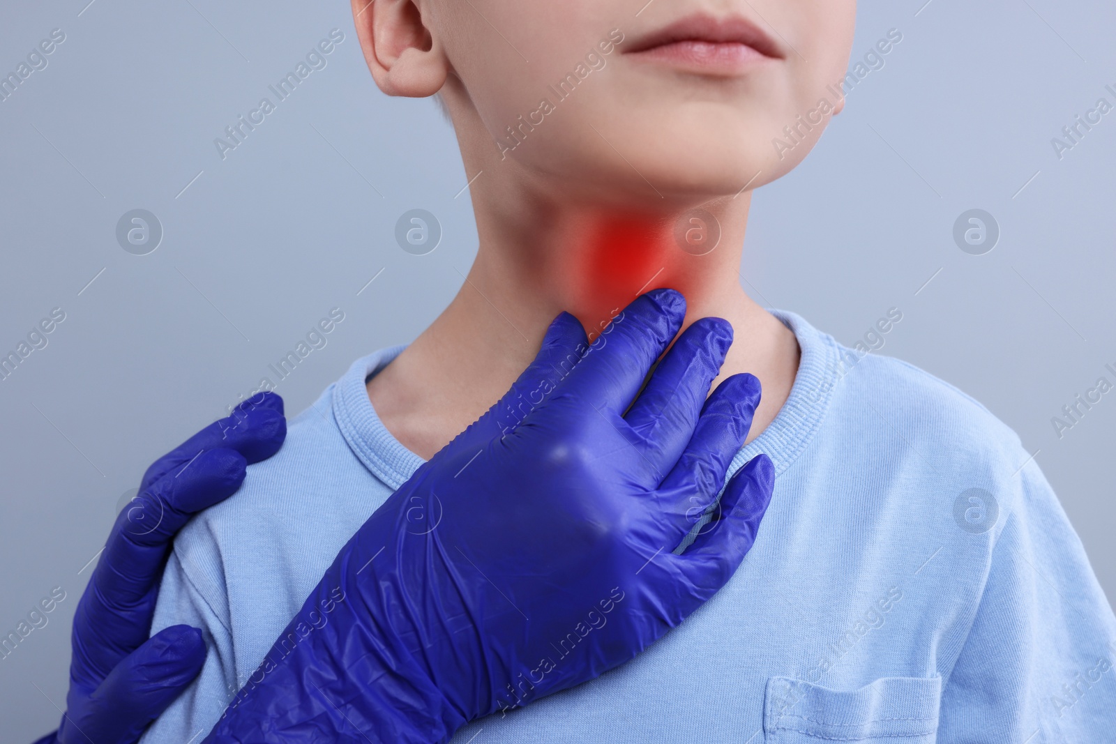 Image of Endocrinologist examining thyroid gland of patient on grey background, closeup