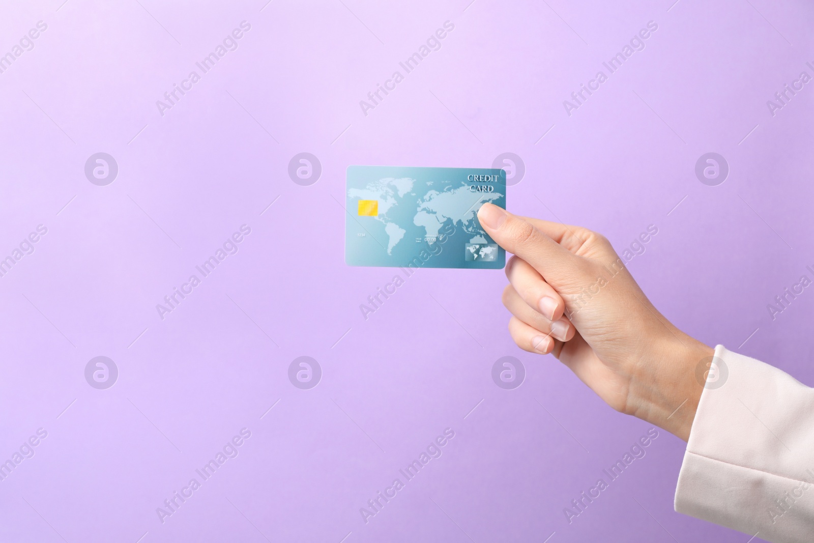 Photo of Woman holding credit card on color background