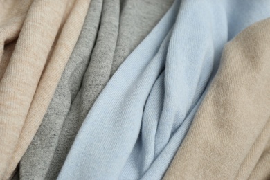 Photo of Different cashmere clothes as background, closeup view