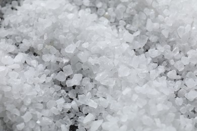 Photo of White natural salt as background, closeup view