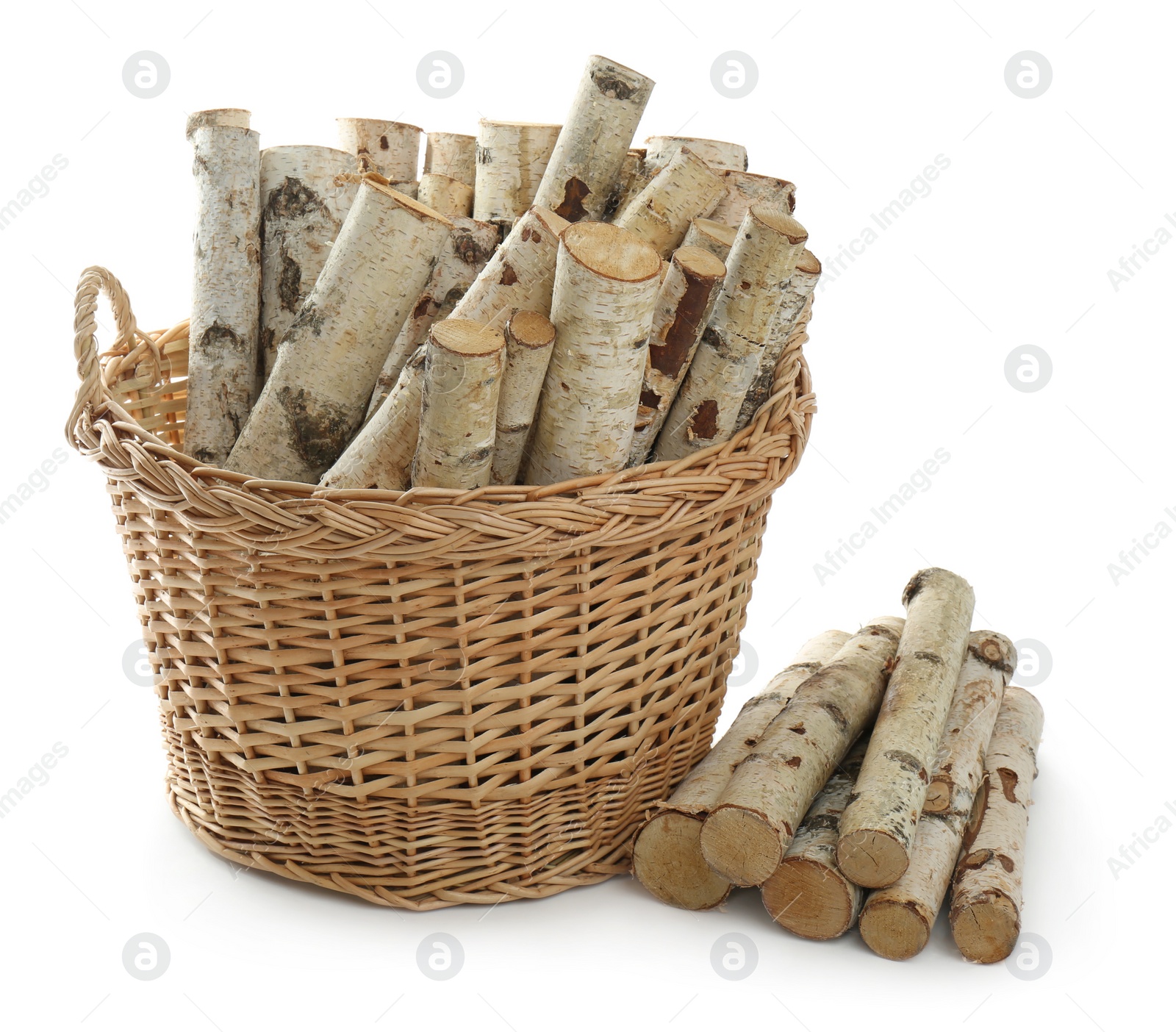 Photo of Wicker basket with firewood on white background