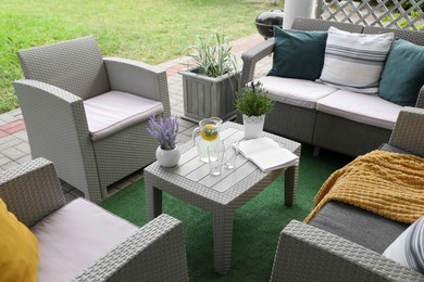 Photo of Beautiful terrace with comfortable furniture in yard