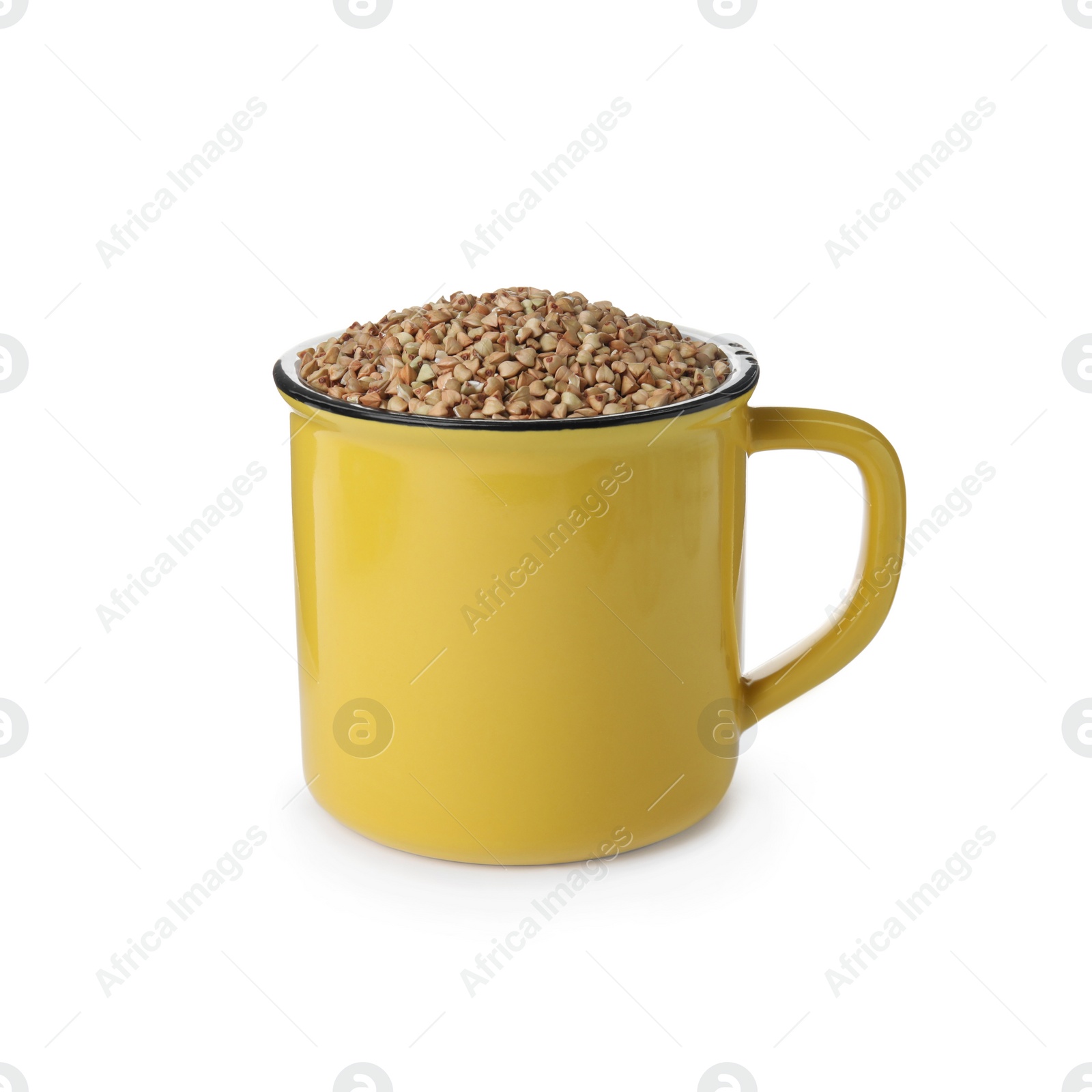 Photo of Organic green buckwheat in mug isolated on white