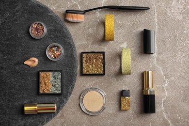 Flat lay composition with cosmetic products on grey background