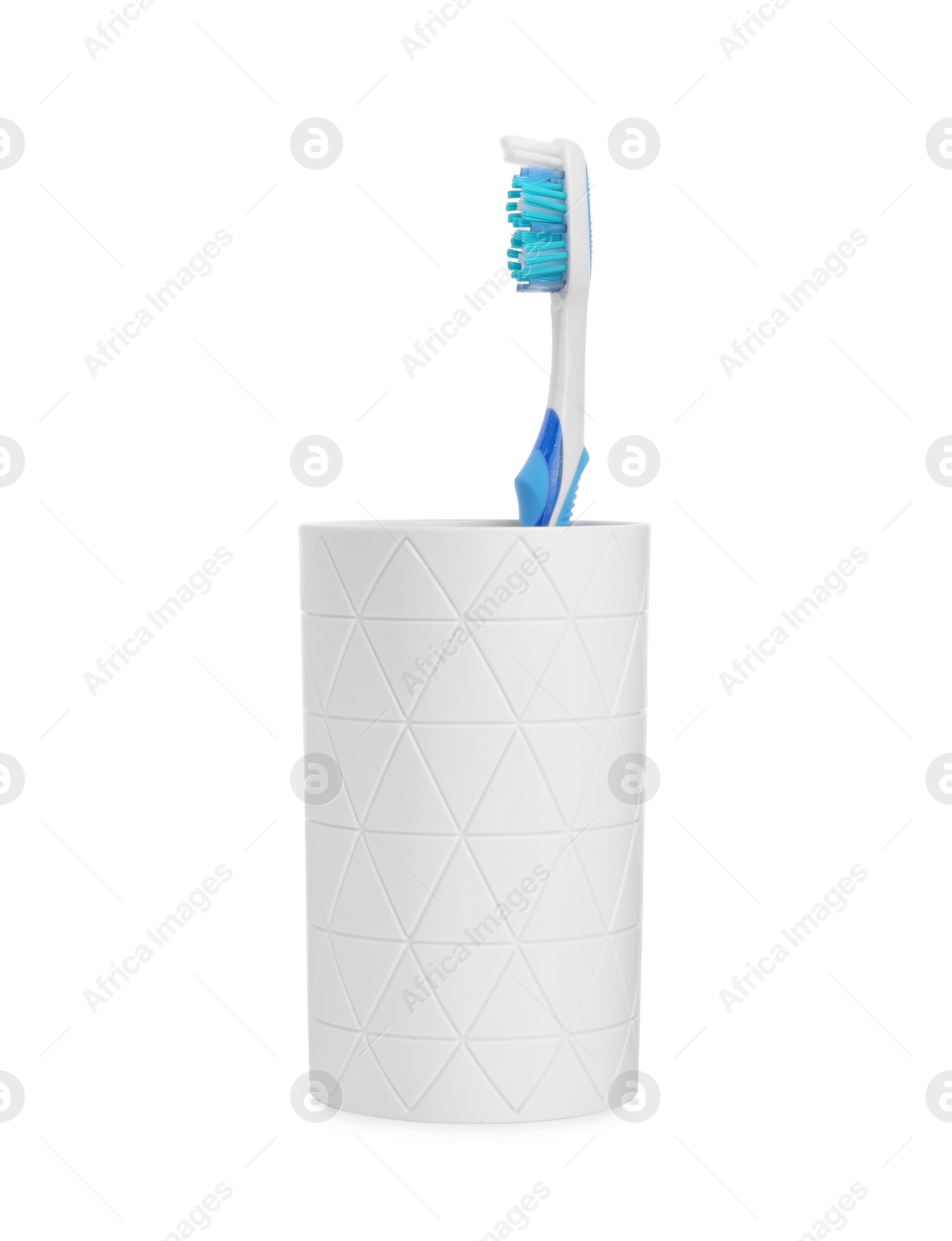 Photo of One plastic toothbrush in holder isolated on white