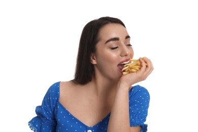 Photo of Beautiful young woman eating French fries on white background