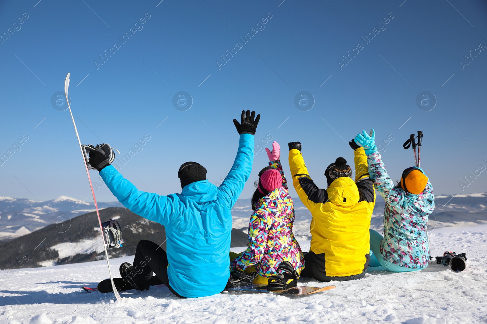 Photo of Group of friends with equipment at ski resort. Winter vacation