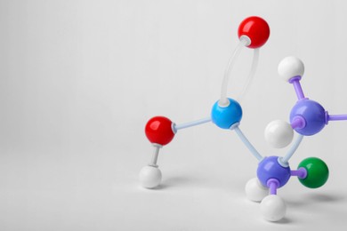 Photo of Structure of molecule on white background, closeup. Chemical model