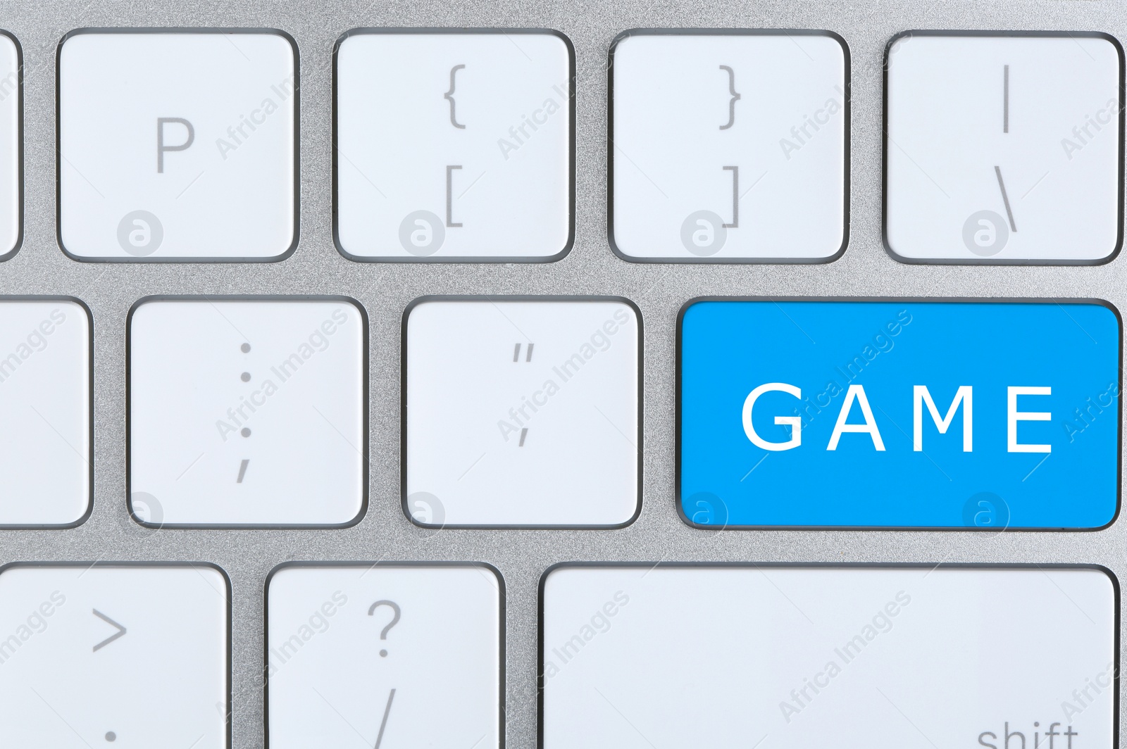 Image of Blue button with word GAME on keyboard, top view