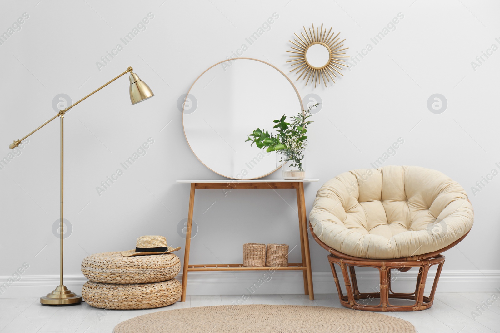 Photo of Stylish round mirror near white wall in room