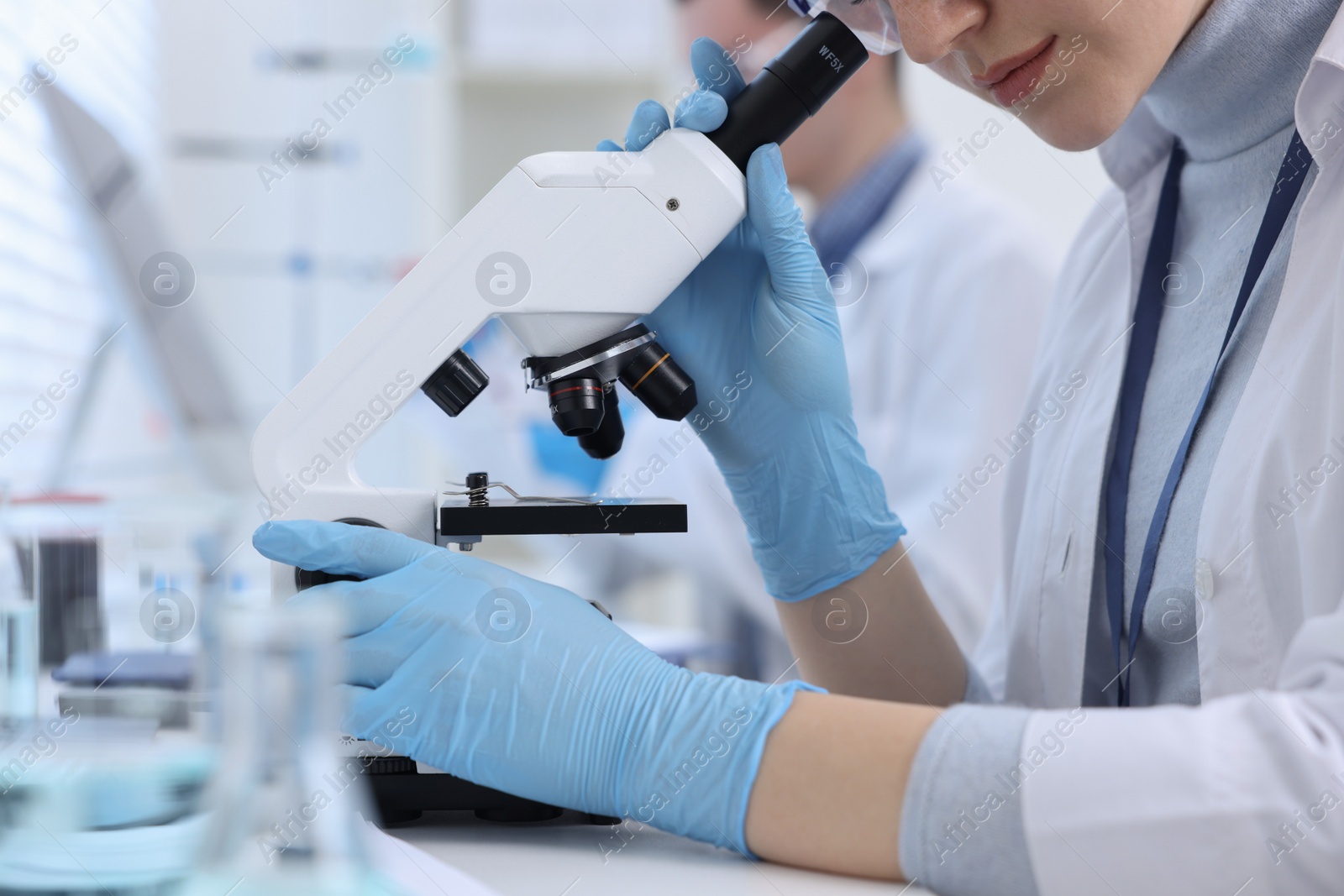 Photo of Scientists working with samples in laboratory, closeup. Medical research