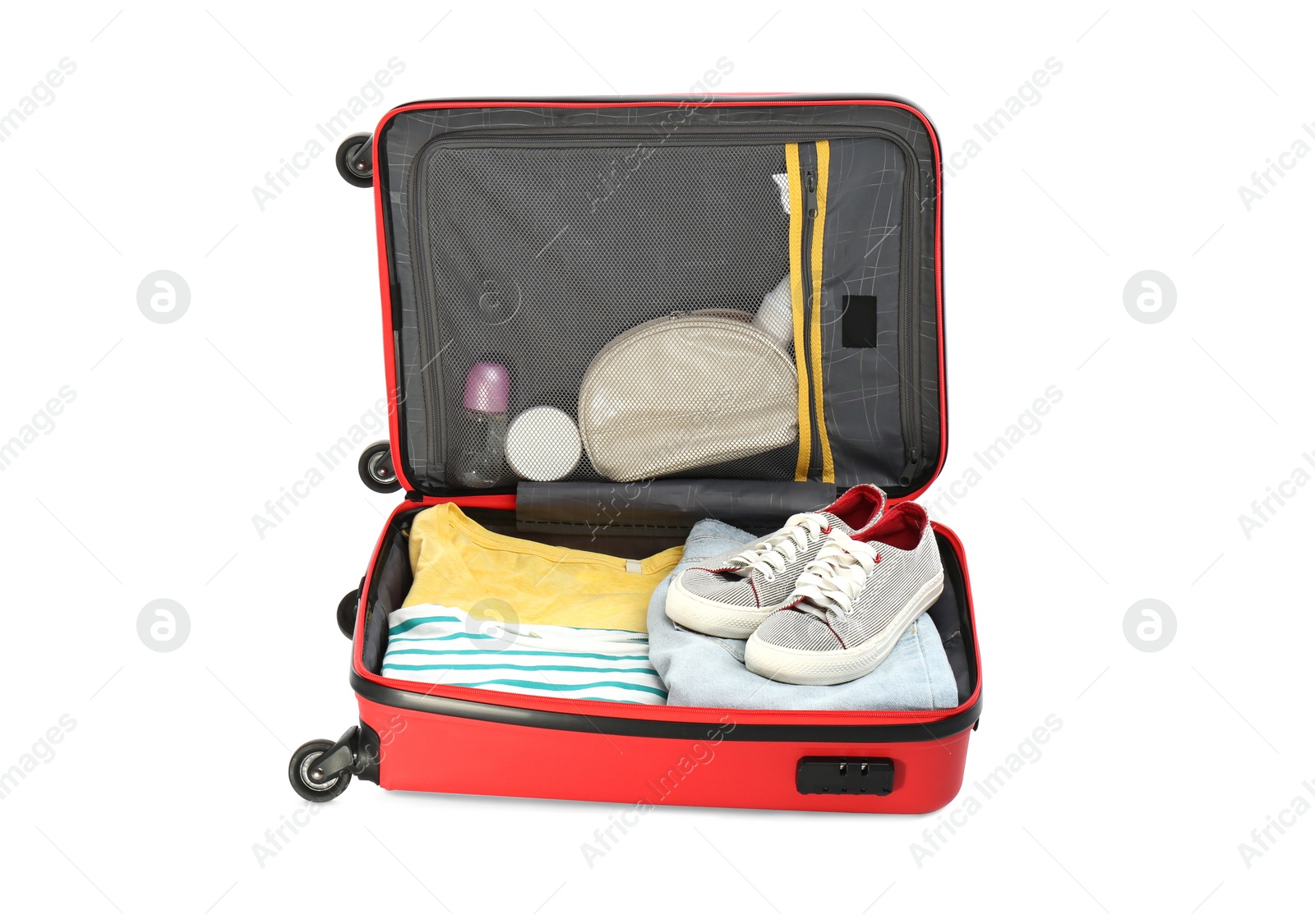 Photo of Packed suitcase with deodorants and clothes on white background