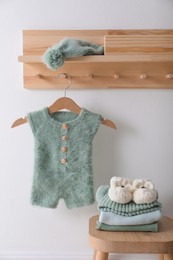 Cute children's clothes and shoes in room