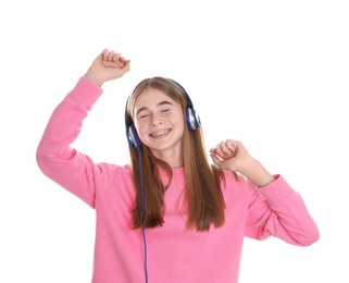 Photo of Teenage girl enjoying music in headphones on white background