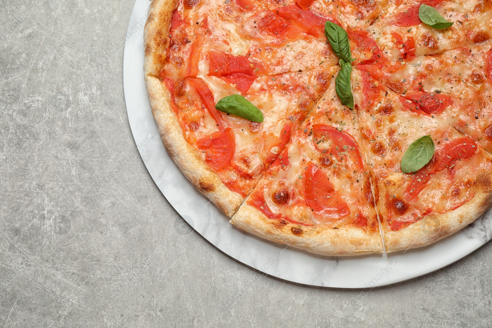Photo of Delicious pizza Margherita on light grey table, top view