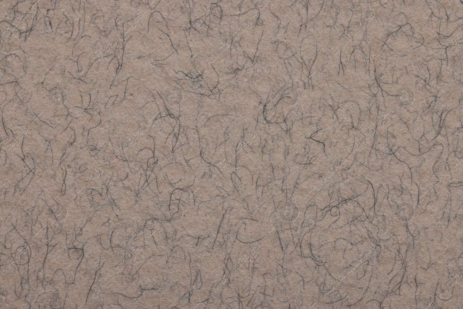 Photo of Texture of grey paper sheet as background, top view