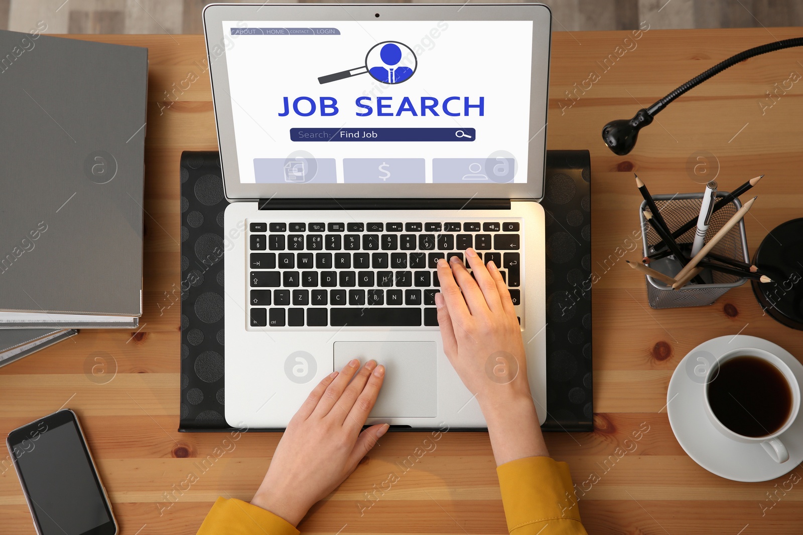 Image of Woman working with modern laptop at wooden table, top view. Job search