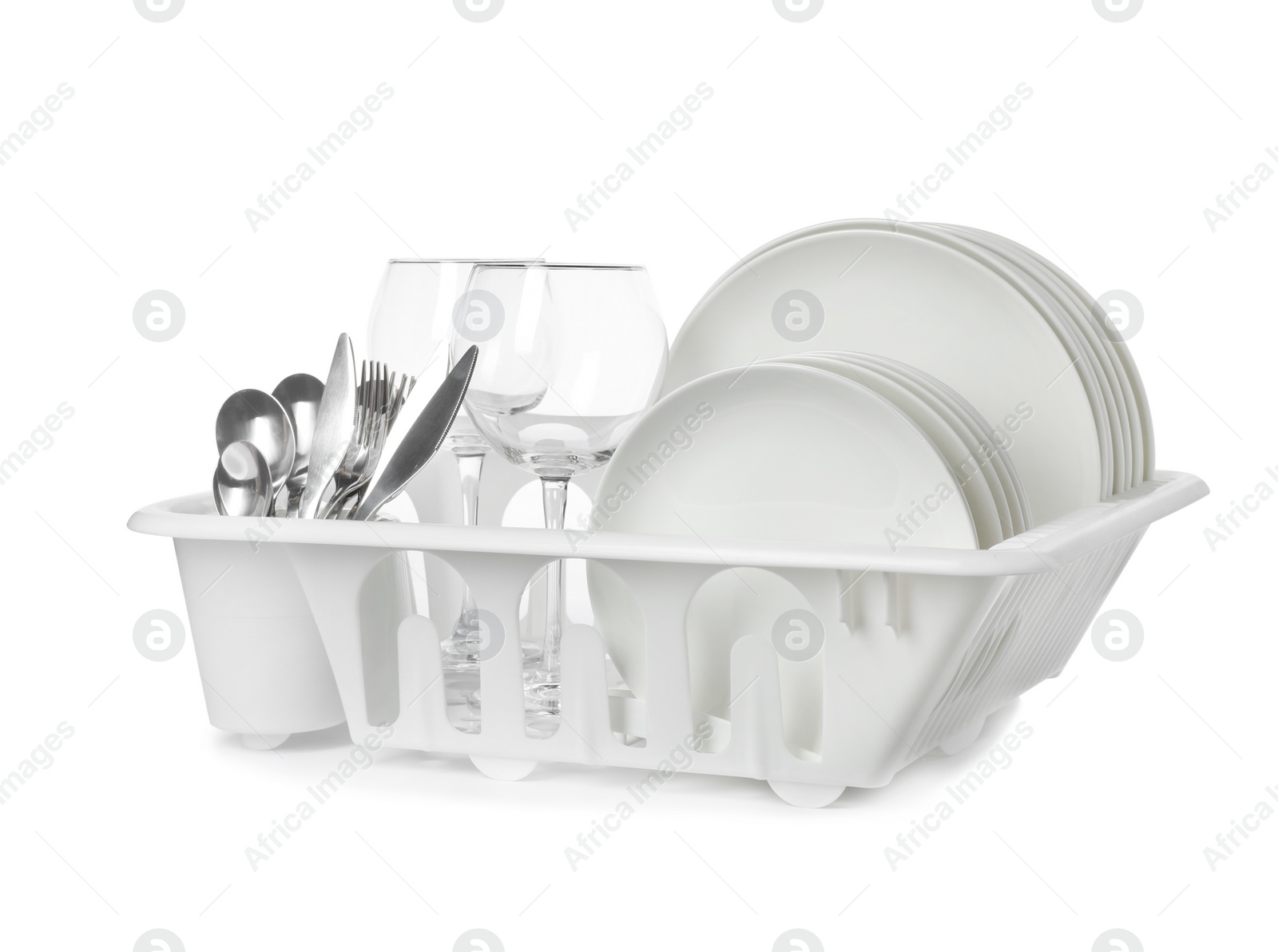 Photo of Rack with clean tableware and utensils on white background. Washing dishes