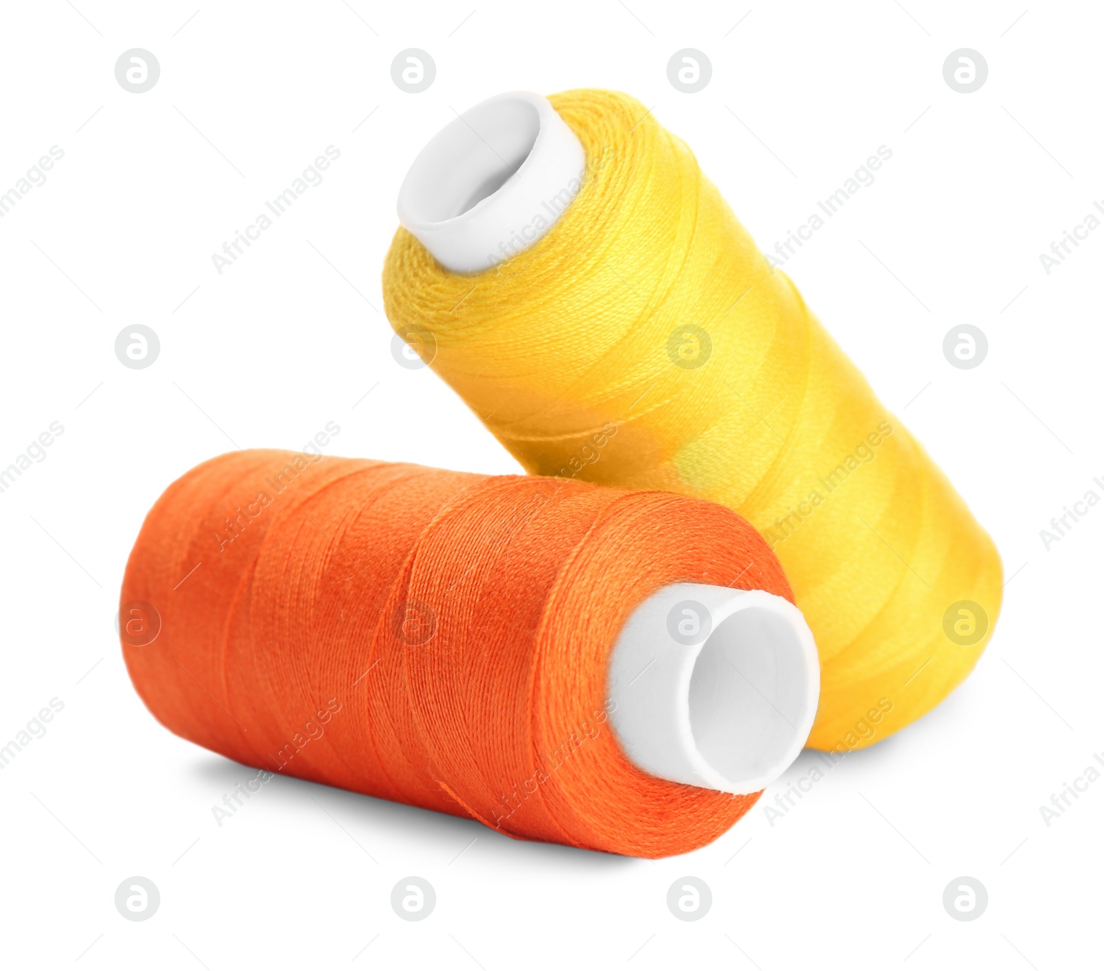 Photo of Different colorful sewing threads on white background