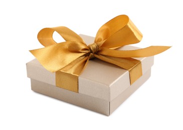 Photo of Golden gift box with satin bow on white background