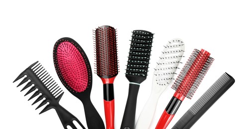 Set of hair brushes and combs isolated on white, top view