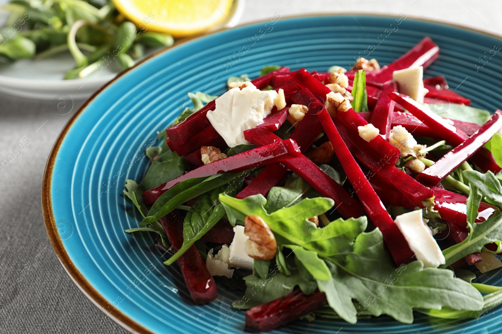 Photo of Plate with delicious beet salad on table, closeup