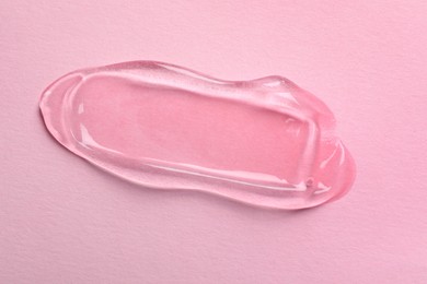 Photo of Swatch of cosmetic gel on pink background, top view