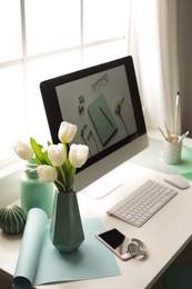 Photo of Stylish workplace interior with modern computer on desk