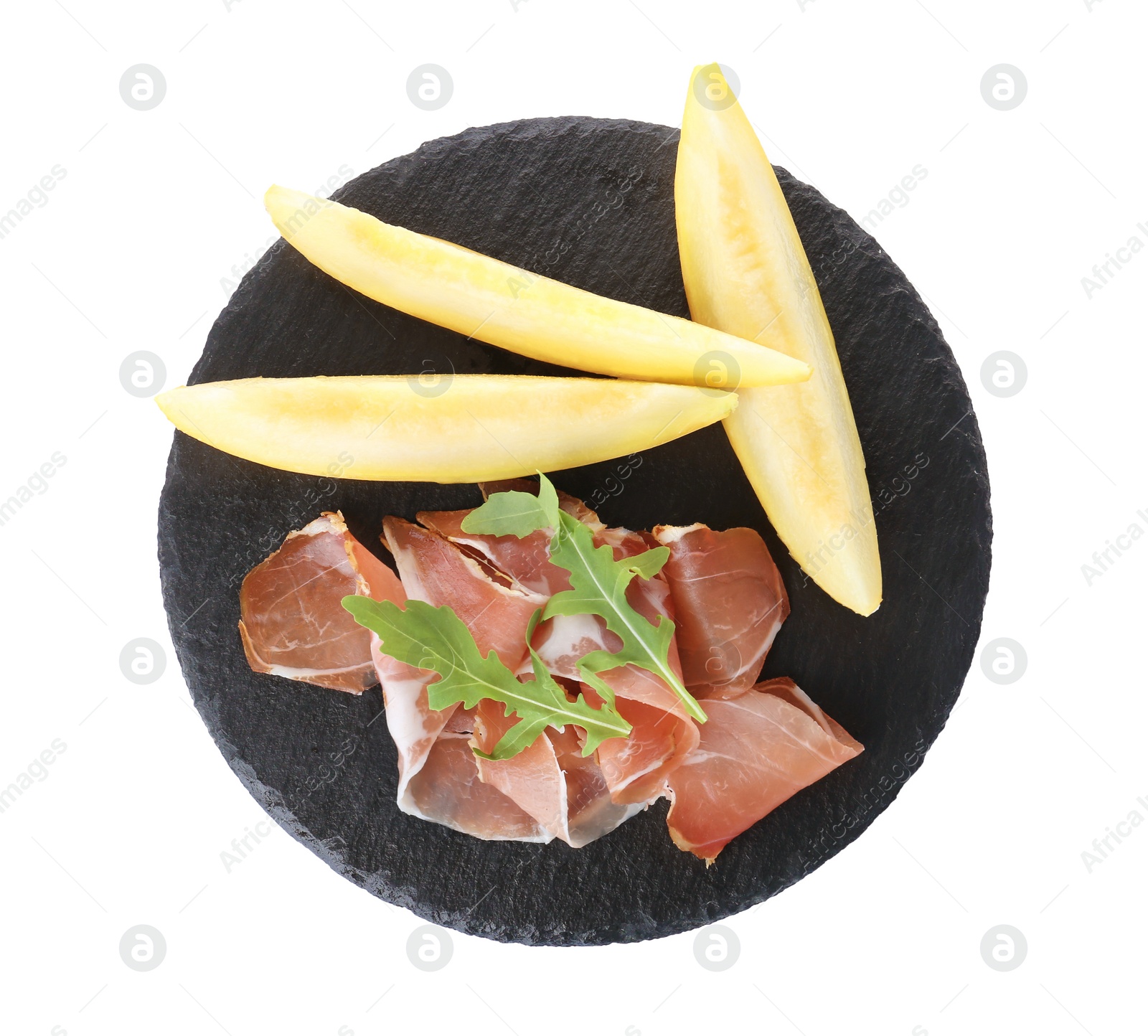 Photo of Slate plate with melon slices and prosciutto on white background, top view