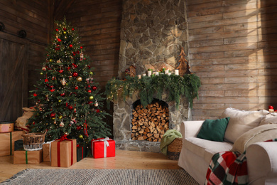 Festive interior with decorated Christmas tree and fireplace