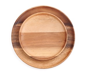 Wooden plates on white background, top view