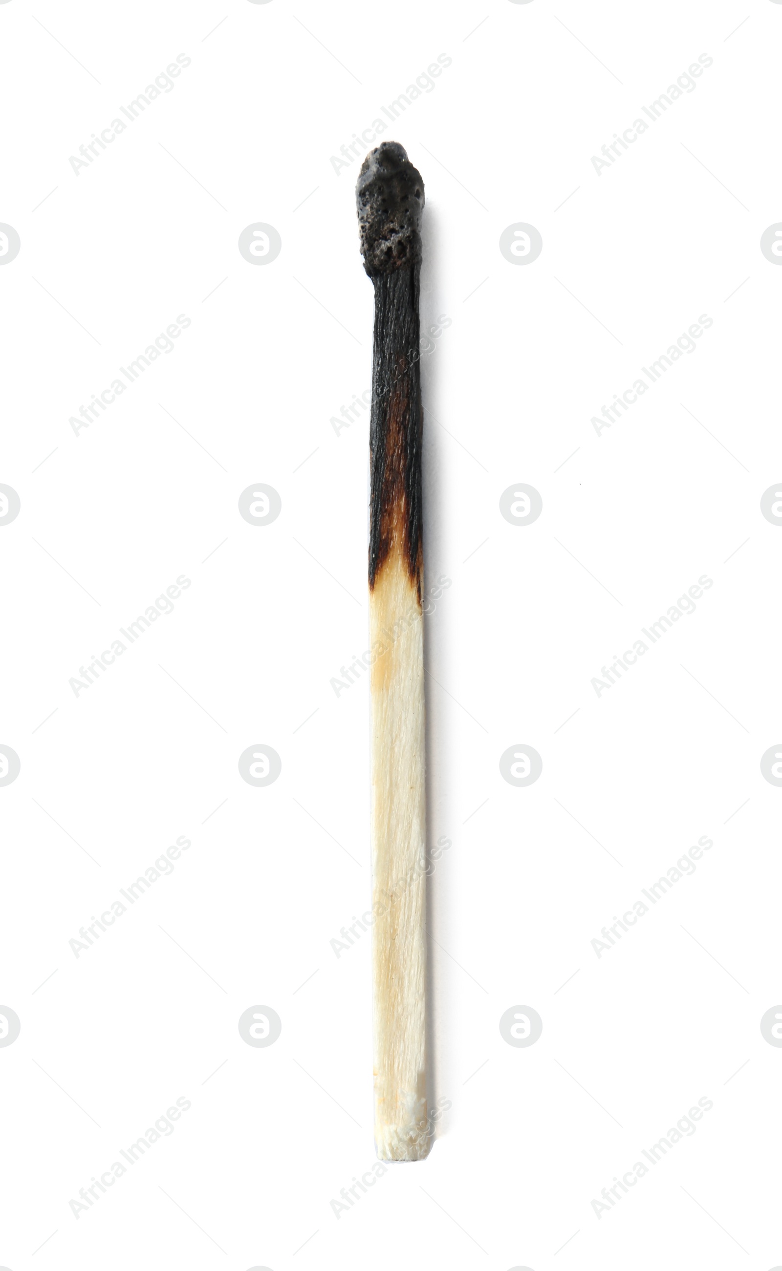 Photo of Burnt match on white background, top view