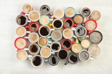 Photo of Flat lay composition with cups of coffee on light background. Food photography