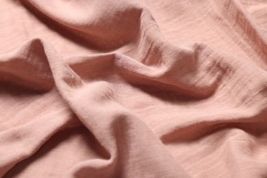 Photo of Texture of soft pastel crumpled fabric as background, closeup