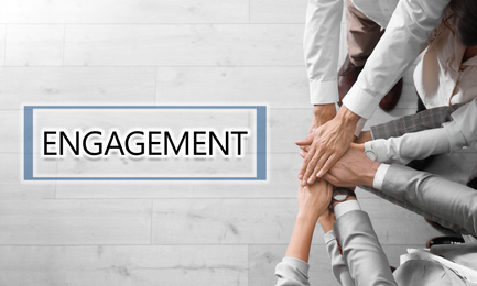 Image of Engagement concept. People holding hands together, top view 