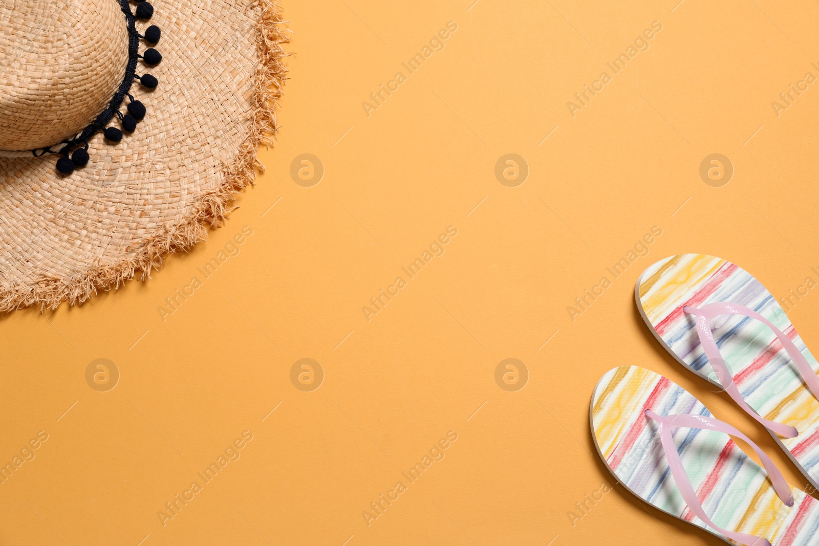 Photo of Beach accessories on color background, flat lay. Space for text