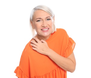 Photo of Mature woman scratching shoulder on white background. Annoying itch
