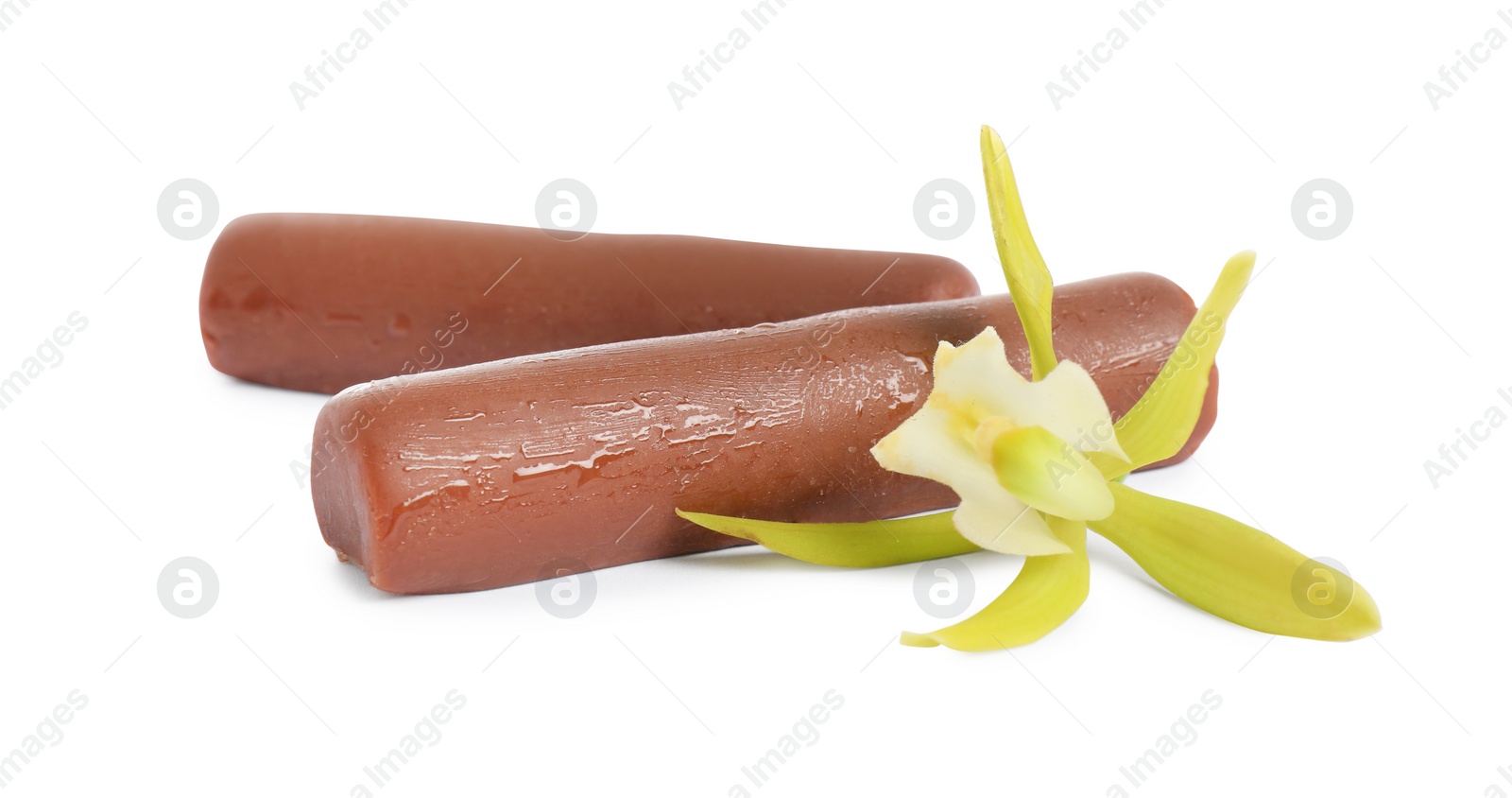 Photo of Glazed curd cheese bars and vanilla flower isolated on white