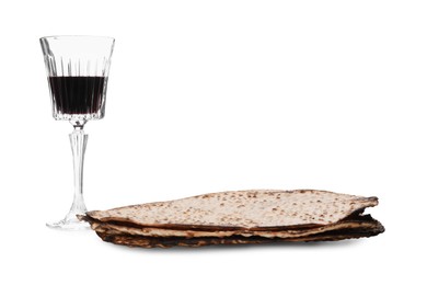 Photo of Tasty matzos and wine on white background. Passover (Pesach) celebration