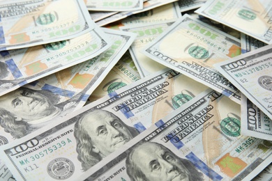 Photo of Many dollar banknotes as background. American national currency