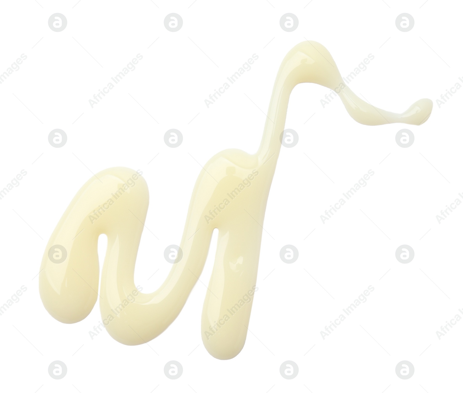 Photo of Spilled tasty condensed milk isolated on white, top view
