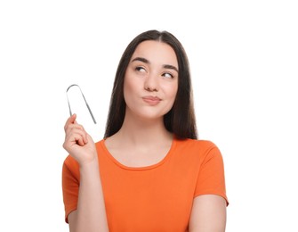 Photo of Beautiful woman with tongue cleaner on white background