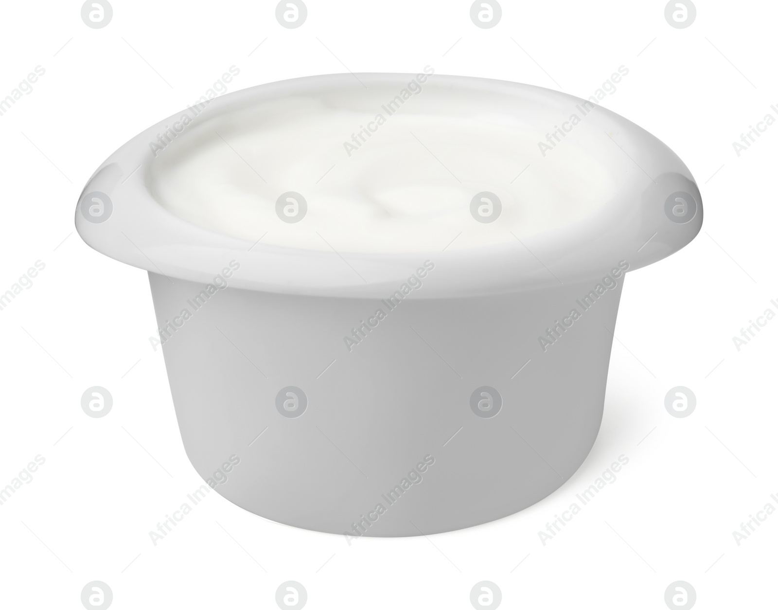 Photo of Delicious natural yogurt in bowl isolated on white