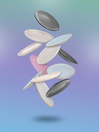 Image of Many different plates falling on pastel light blue violet gradient background