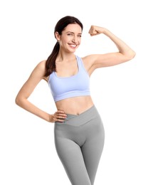 Photo of Happy young woman with slim body showing muscles on white background