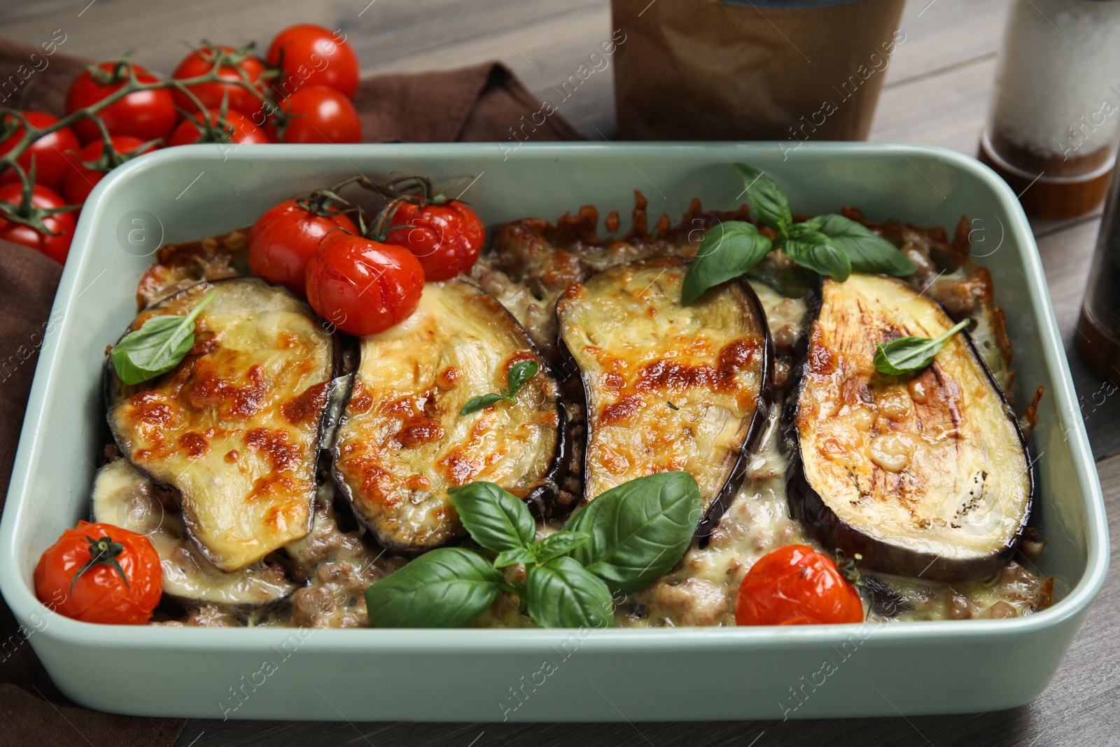 Photo of Delicious eggplant lasagna in baking dish on table, closeup